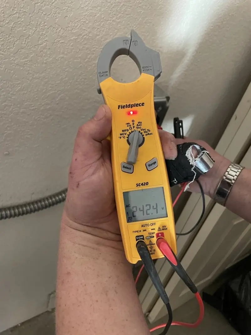 Voltage testing with clamp meter during Electrical Installation Services in Lewisburg